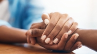Closeup shot of two unrecognizable people holding hands