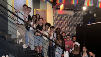 The LGBTQ+ Trainees and Allies pose on a staircase